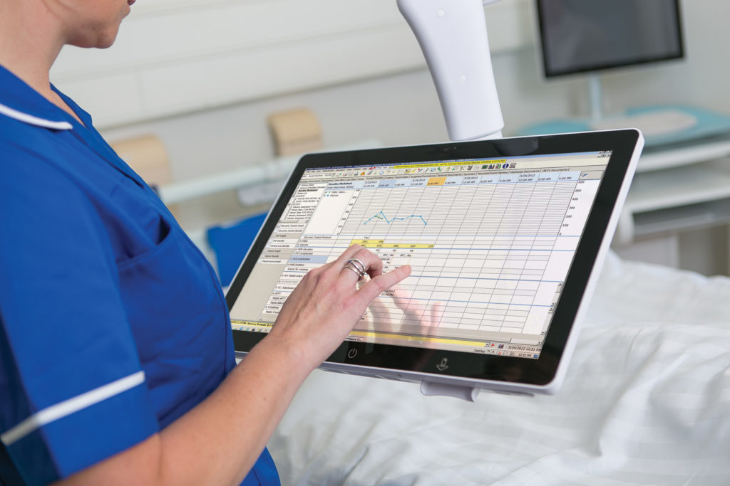 Nurse using bed side terminal